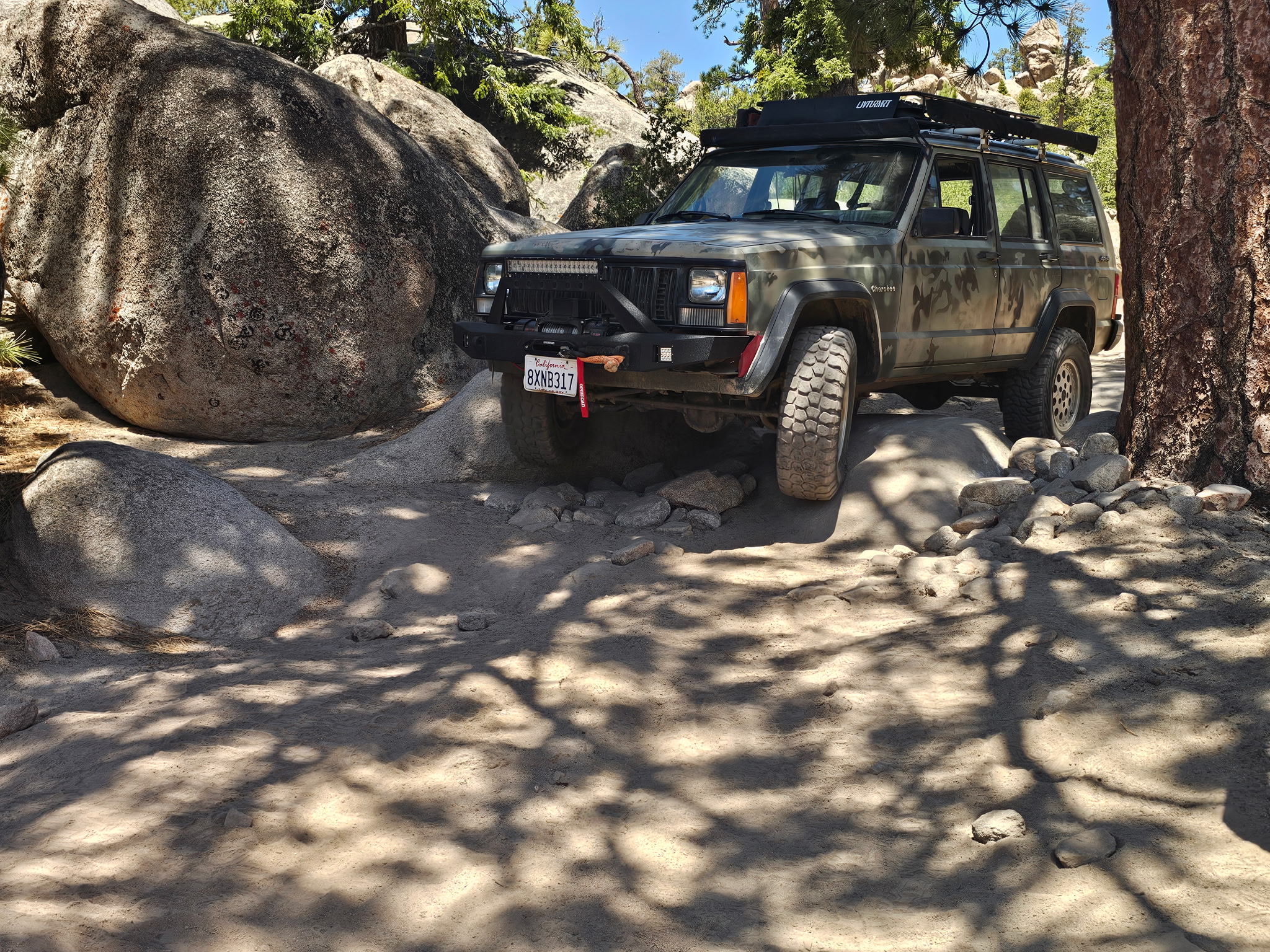 Trail-ready Get Rolling rig among Big Bear boulders